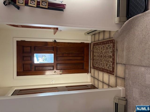 6 Patton Street Lodi, NJ 07644 - Photo 13 of 13 a living room with furniture and a rug