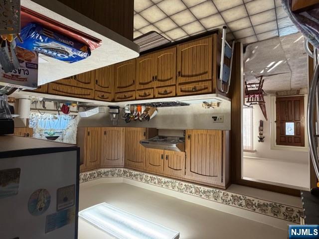 6 Patton Street Lodi, NJ 07644 - Photo 7 of 13 a kitchen with granite countertop a sink stove and cabinets