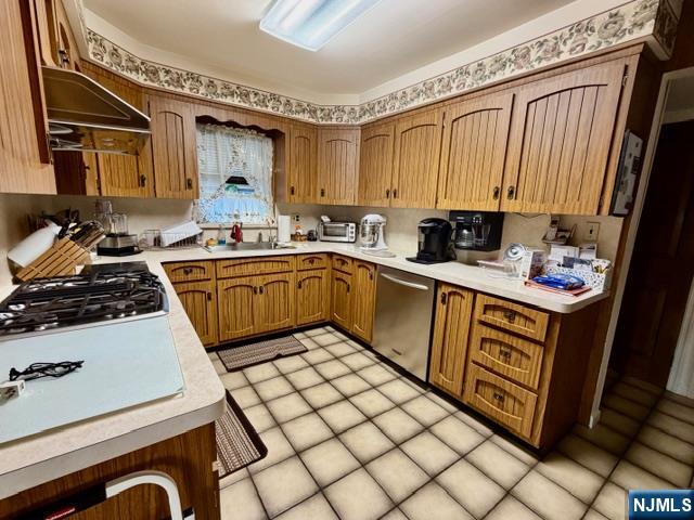 6 Patton Street Lodi, NJ 07644 - Photo 8 of 13 a kitchen with a sink appliances and cabinets