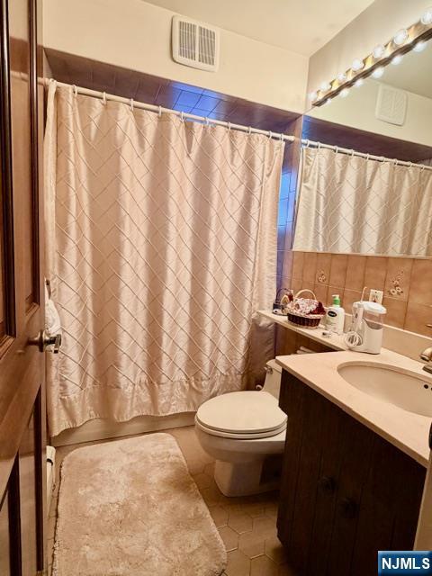 6 Patton Street Lodi, NJ 07644 - Photo 10 of 13 a bathroom with a sink and a mirror