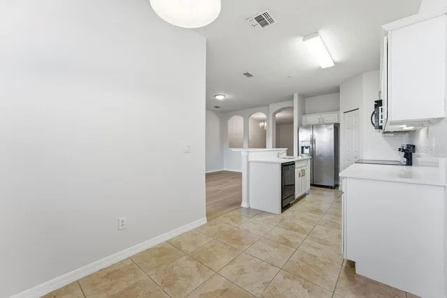 a view of a kitchen with a sink