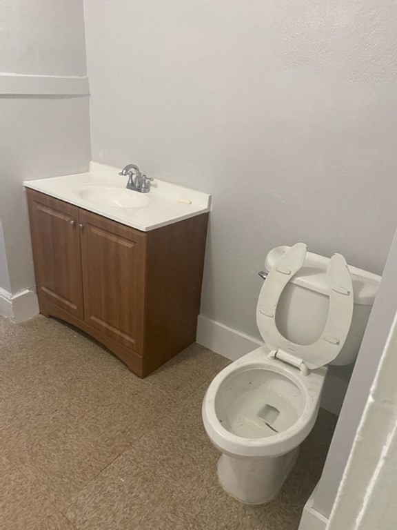 91-93 Grover Street Springfield, MA 01104 - Photo 4 of 12 a bathroom with a toilet sink and mirror