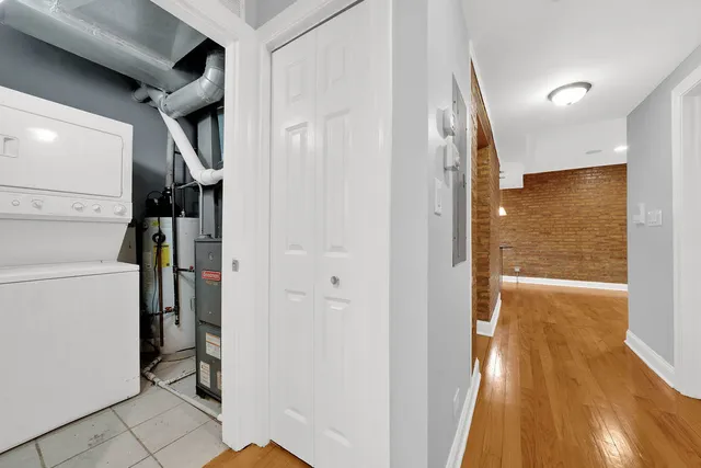 a view of hallway with wooden floor