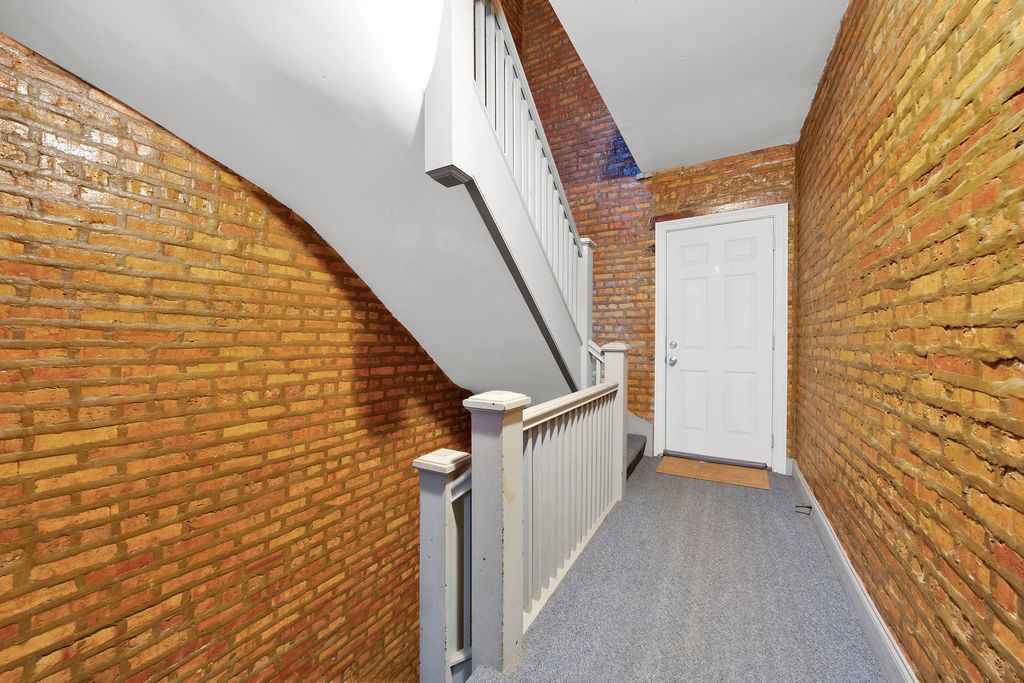 2256 West Arthur Avenue, Unit 2 Chicago, IL 60645 - Photo 2 of 18 a view of a stairs and an entryway