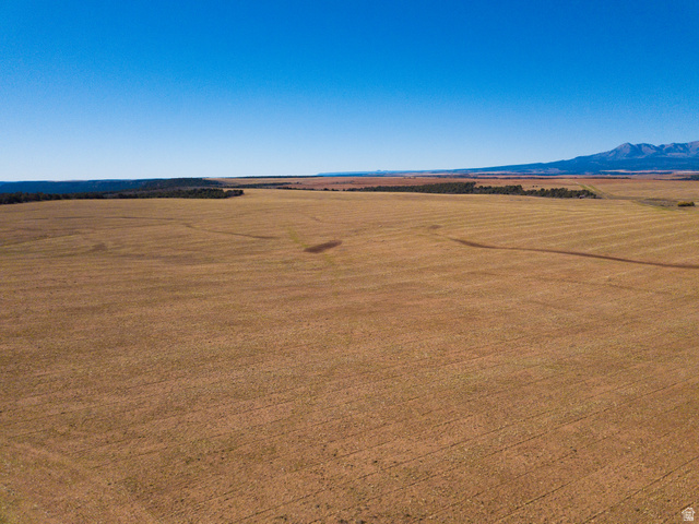 100 South Pearson Cutoff Road Monticello, UT 84535 - Photo 9 of 9 Aerial view of sparsely populated area with a mountainous background