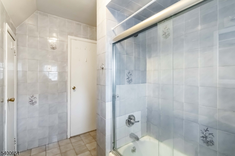 592 Summer Avenue Newark, NJ 07104 - Photo 11 of 16 a bathroom with a shower
