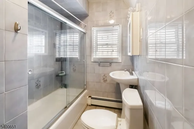 a bathroom with a sink toilet and bathtub