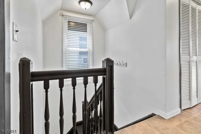 a view of a balcony with wooden floor