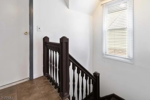 a view of a hallway with windows