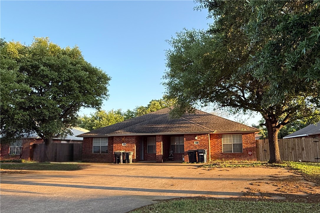 a view of a large trees with a big yard