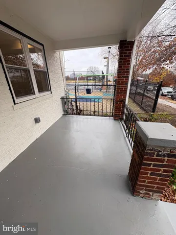 a view of an empty room with windows