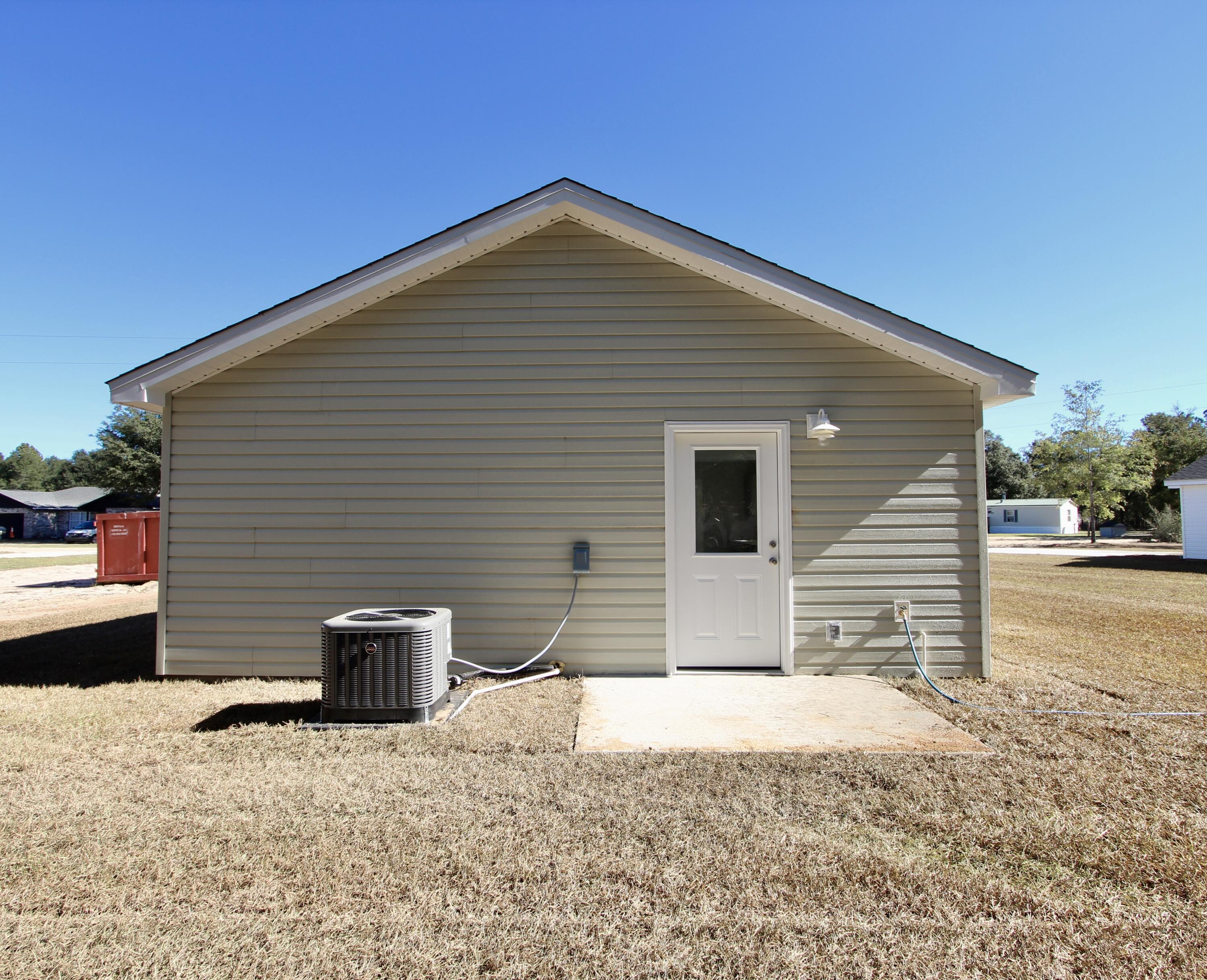 4662 Falcon Way Crestview, FL 32539 - Photo 18 of 20 a front view of a house with a yard