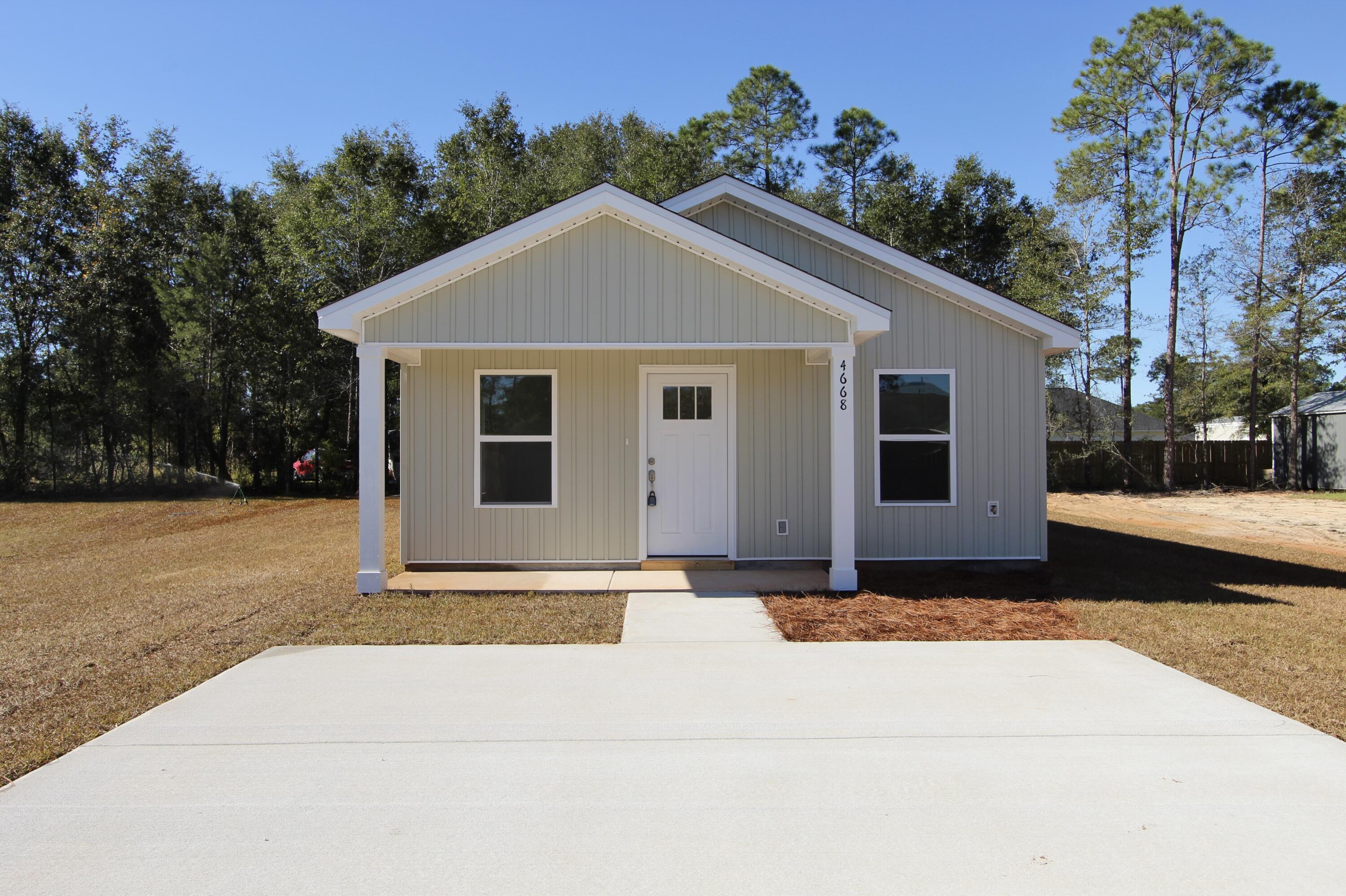 4662 Falcon Way Crestview, FL 32539 - Photo 2 of 20 a view of backyard of house with trees