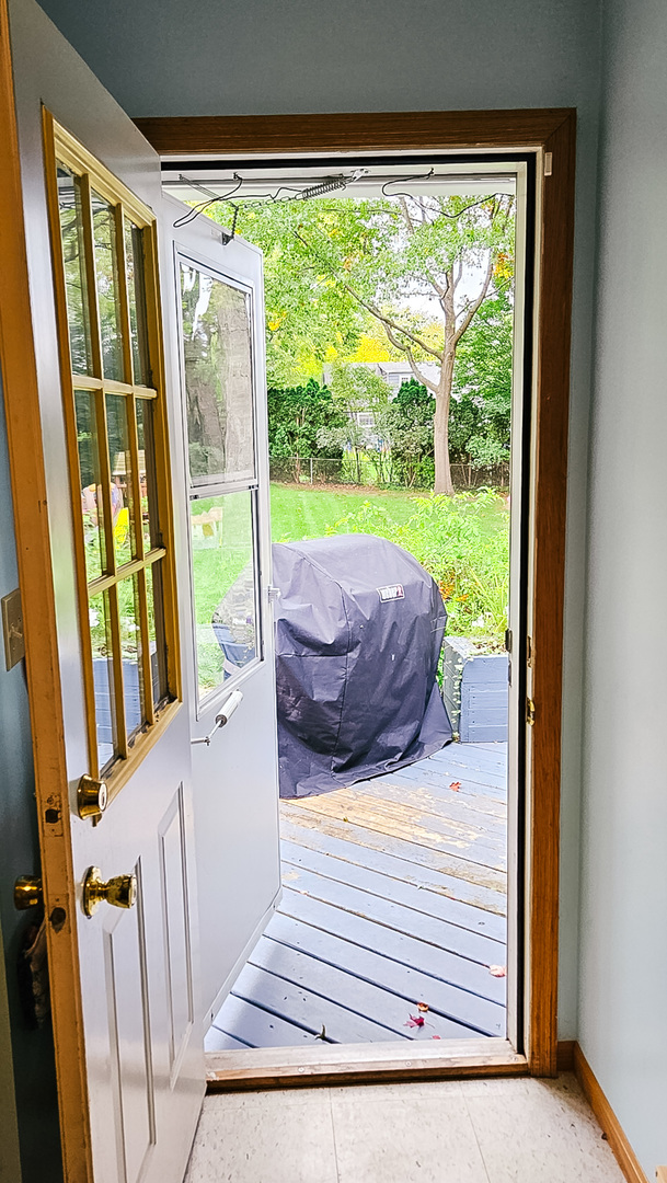1808 May Drive Johnsburg, IL 60051 - Photo 11 of 32 a view of a porch with wooden floor and outdoor space
