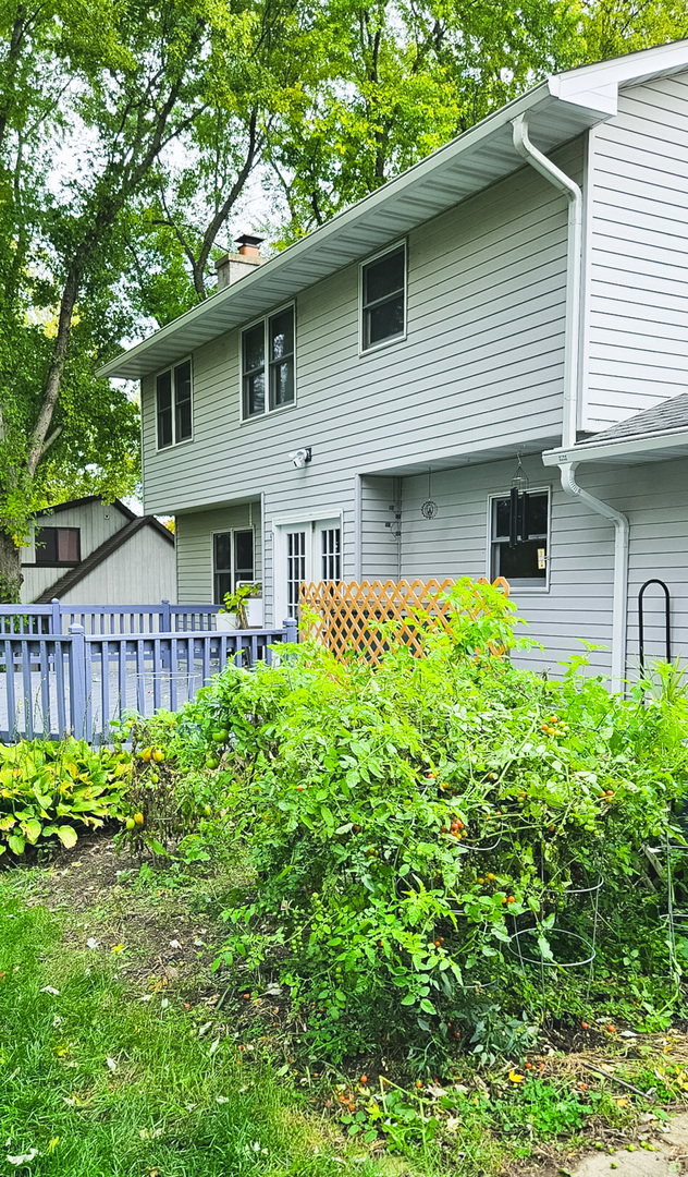 1808 May Drive Johnsburg, IL 60051 - Photo 14 of 32 a house with lots of trees in the background