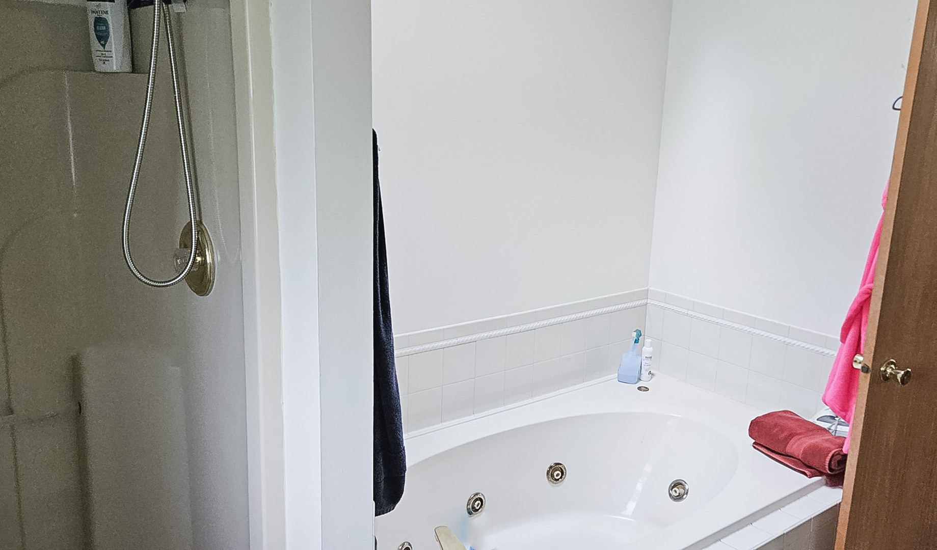 1808 May Drive Johnsburg, IL 60051 - Photo 20 of 32 a bathroom with a tub and a shower