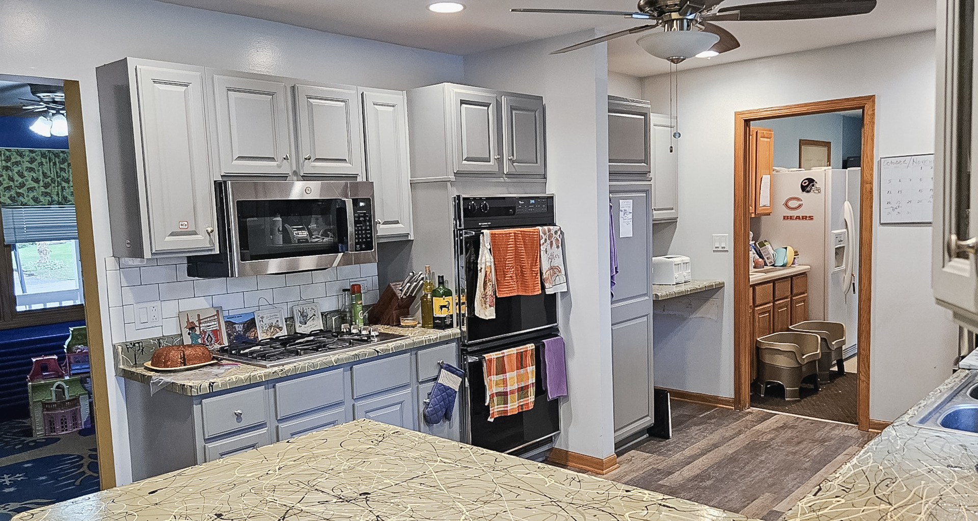 1808 May Drive Johnsburg, IL 60051 - Photo 6 of 32 a kitchen with stainless steel appliances kitchen island granite countertop a refrigerator oven a sink a stove and a refrigerator