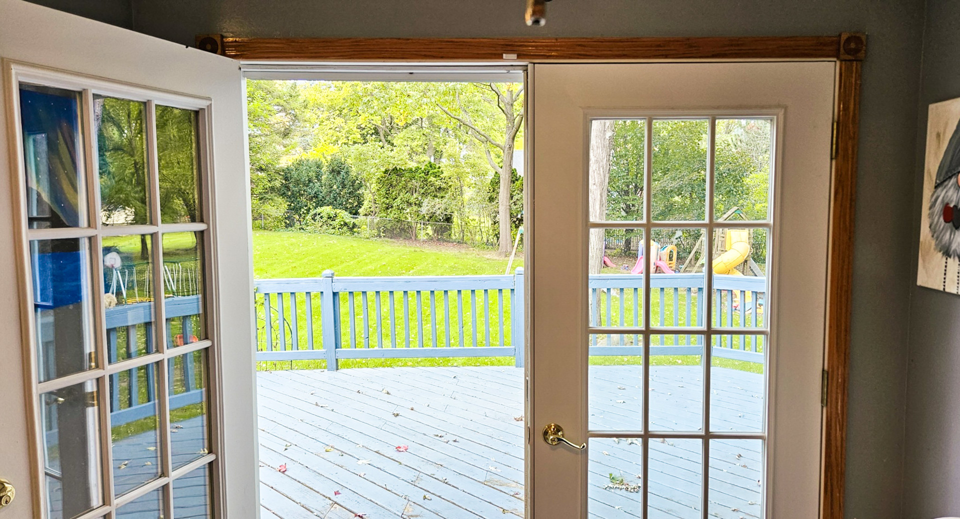1808 May Drive Johnsburg, IL 60051 - Photo 9 of 32 a view of an empty room with wooden floor and a glass door