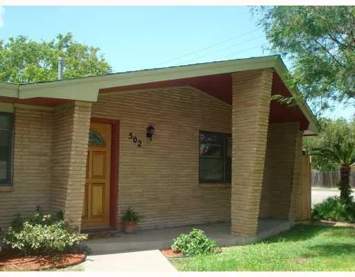 a living room with a dining table and chairs