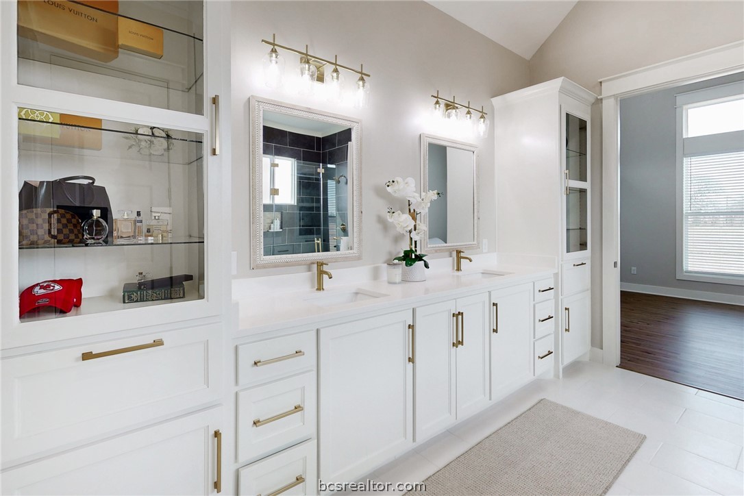 13504 Hudson Farms Road Hearne, TX 77859 - Photo 26 of 48 This master suite bath gets light from multiple directions. Wonderful flow, no congestion, lots of storage space and expansive ceiling lines make this space an area you'd like to linger in.