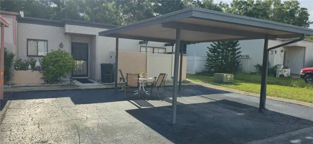 a view of a backyard with a small pool