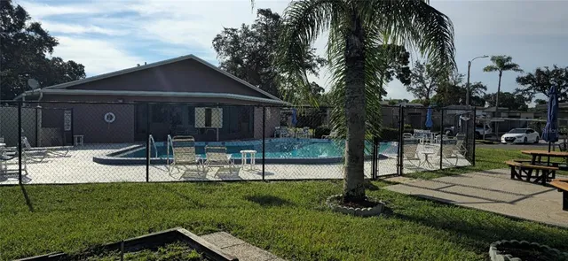 a view of house with patio outdoor seating and yard