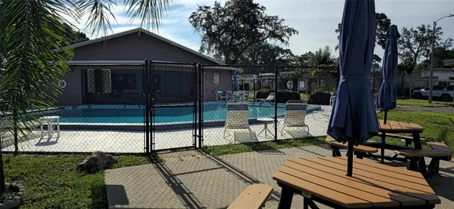 a view of a two chairs in the garden