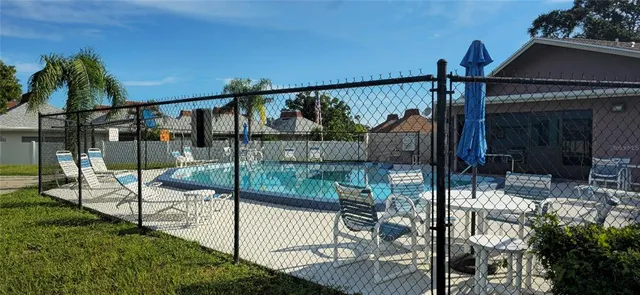 a kitchen with granite countertop a stove a sink and a microwave