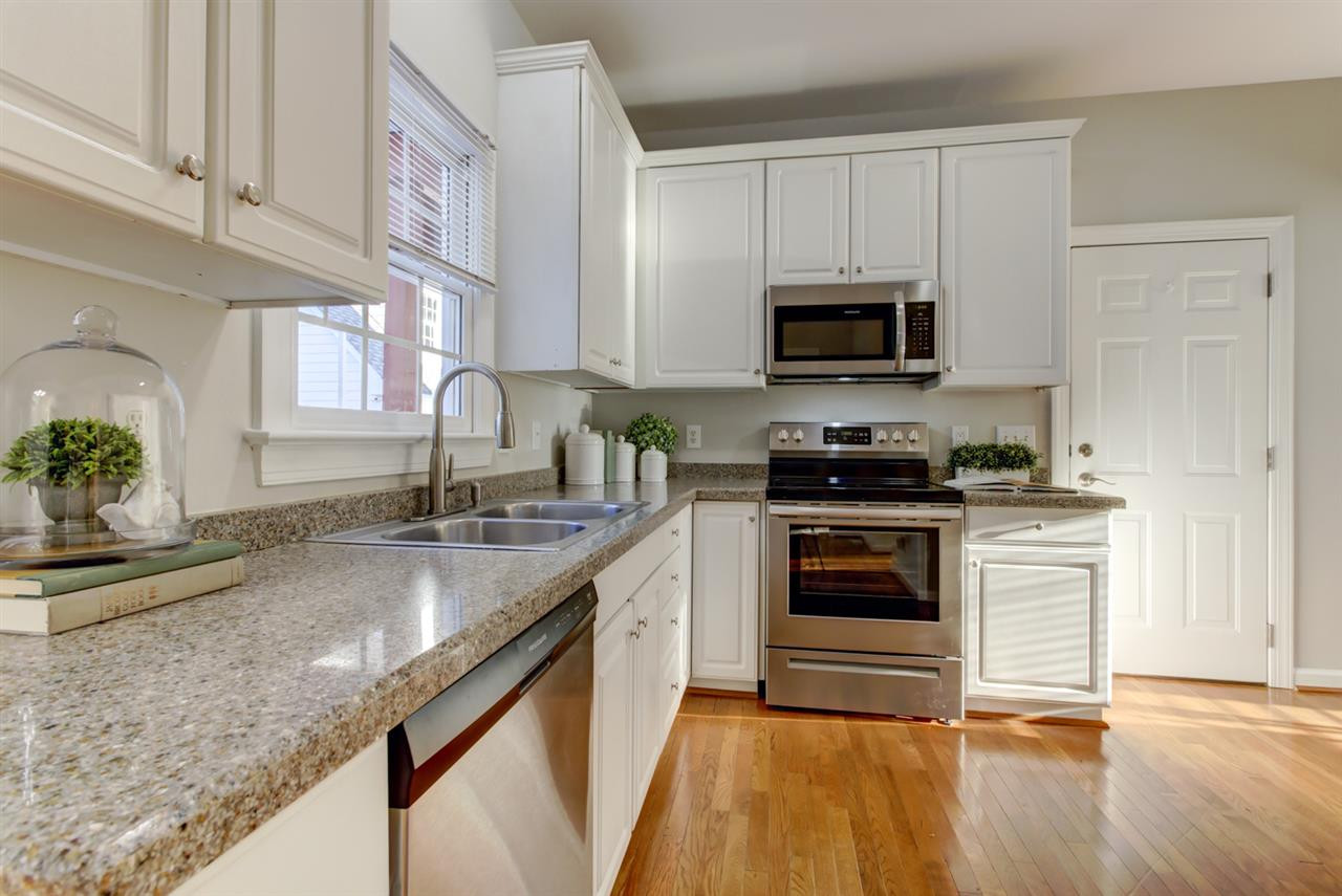 7220 Ridgeline Drive Raleigh, NC 27613 - Photo 4 of 16 GRANITE counters and new STAINLESS STEEL appliances are a few of the great features of the Kitchen. The hardwood floors continue through the breakfast area, hallway and into the separate dining room. Kitchen