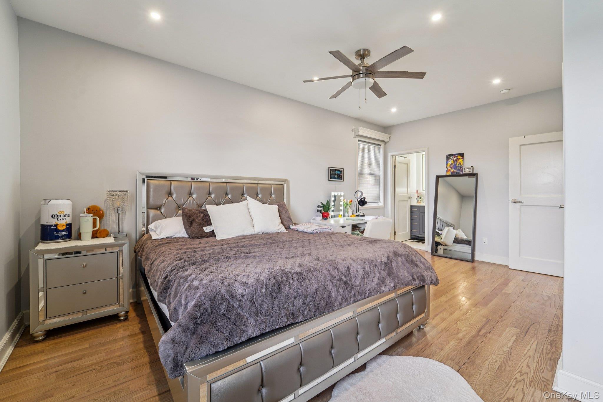 109 Bennett Road Newburgh, NY 12550 - Photo 18 of 41 Bedroom 1: This inviting space features hardwood flooring and recessed lighting, creating a bright and welcoming atmosphere with an en-suite bathroom.