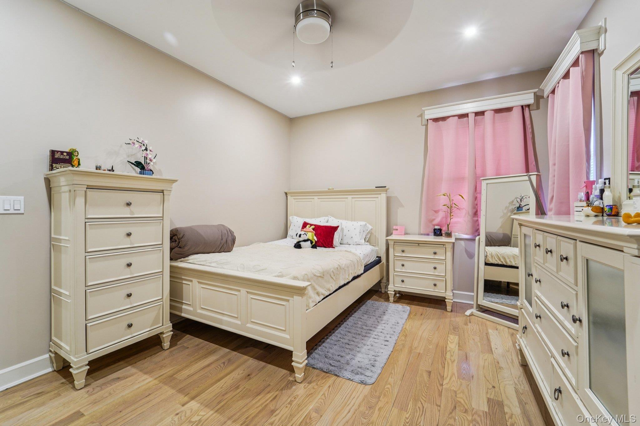 109 Bennett Road Newburgh, NY 12550 - Photo 21 of 41 Bedroom 3: This room features light hardwood flooring, recessed lighting, and a ceiling fan.