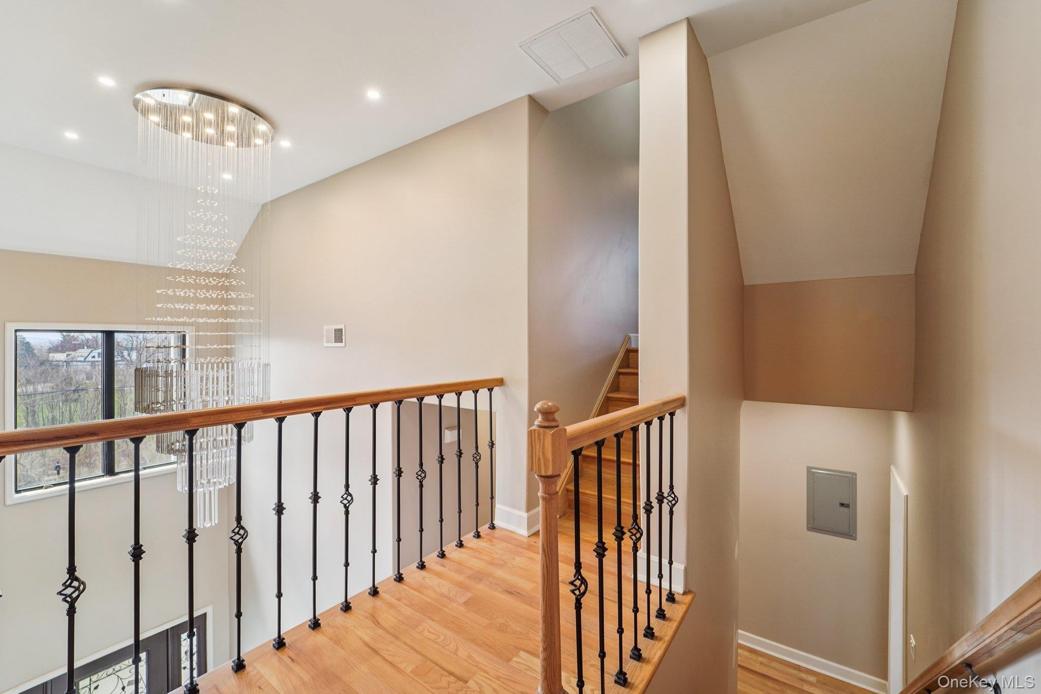 109 Bennett Road Newburgh, NY 12550 - Photo 23 of 41 Upper level featuring hardwood flooring and a stylish chandelier with crystal accents access to game room/office/gym.