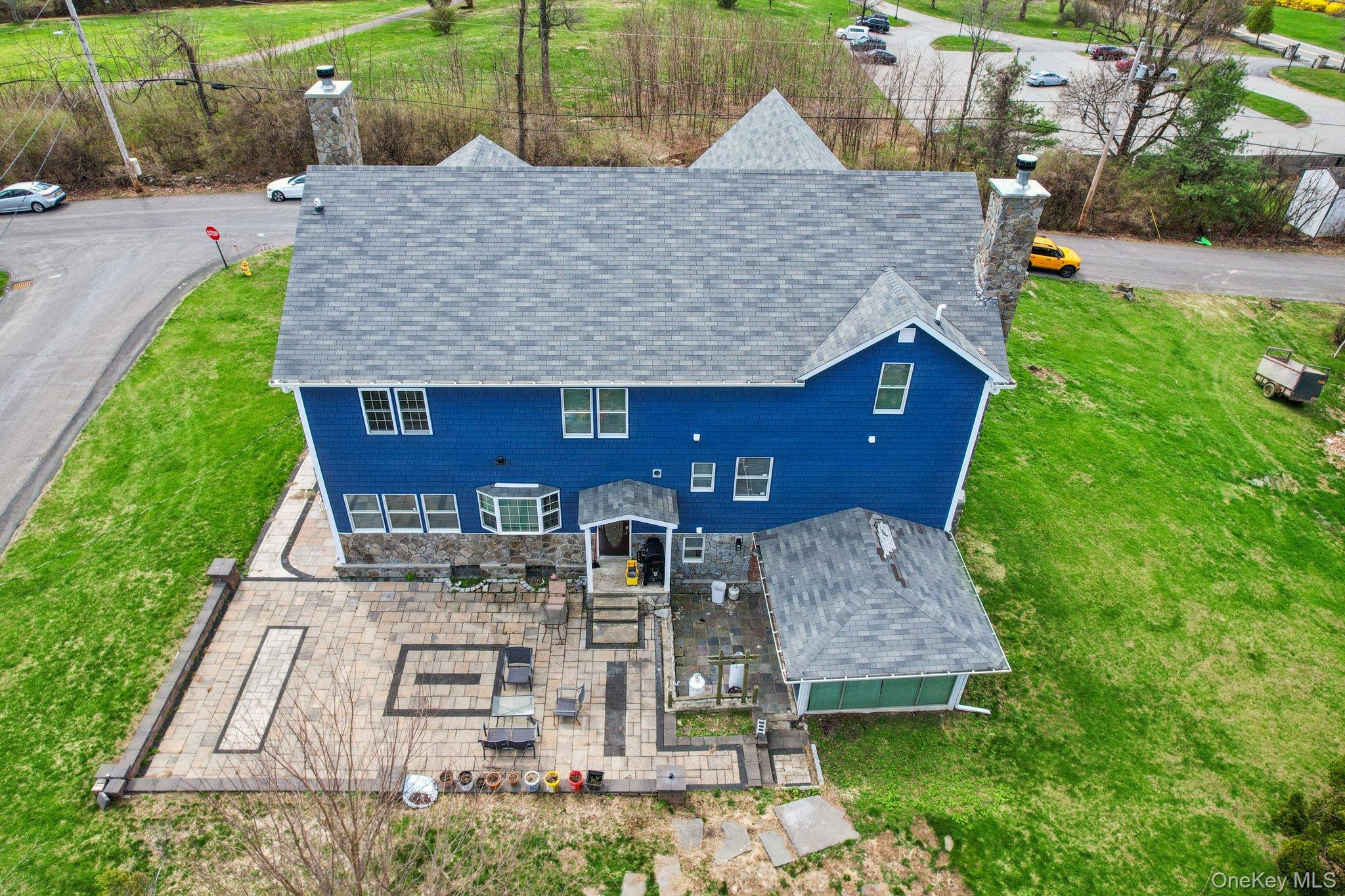 109 Bennett Road Newburgh, NY 12550 - Photo 6 of 41 The property features a stone paver patio with decorative darker stone accents.