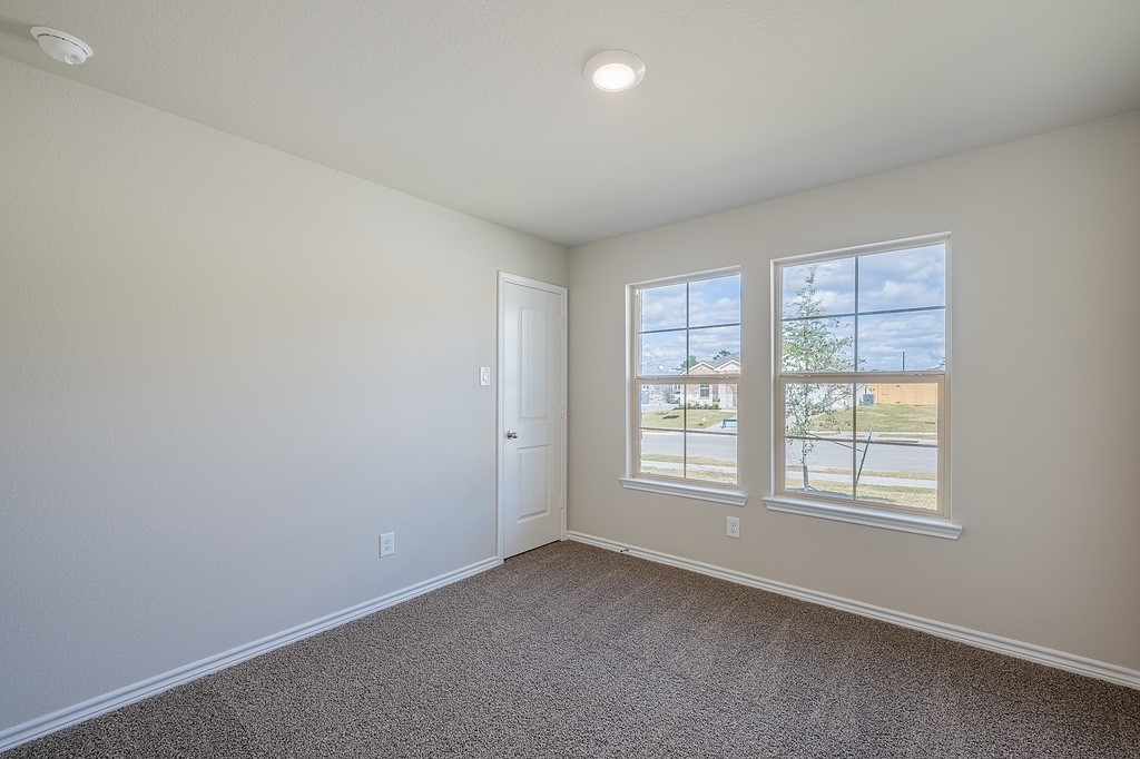 602 Davy Street Brenham, TX 77833 - Photo 14 of 16 an empty room with windows