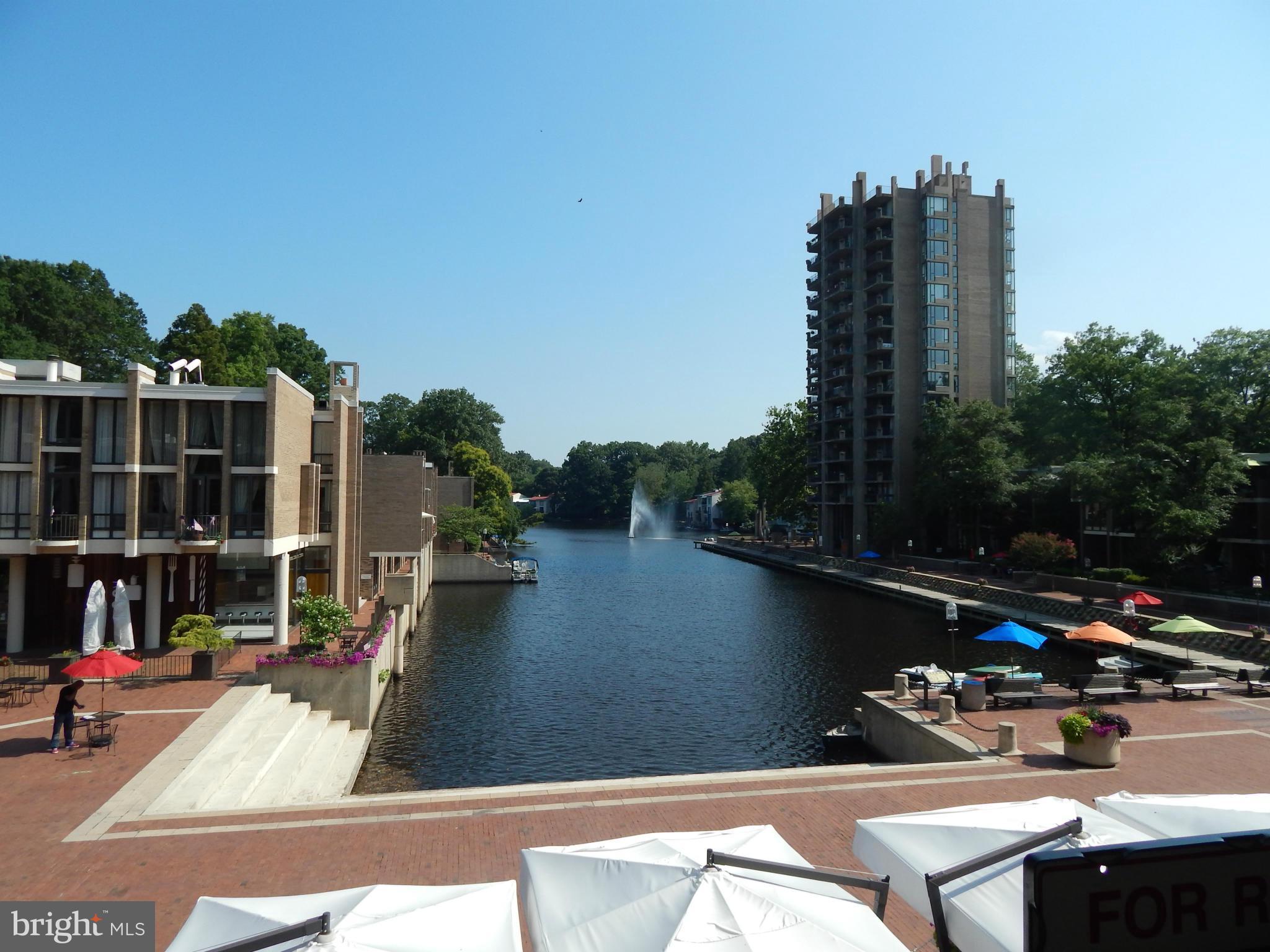 1620 Chimney House Road, Unit 1620 Reston, VA 20190 - Photo 1 of 16 a view of swimming pool from a balcony