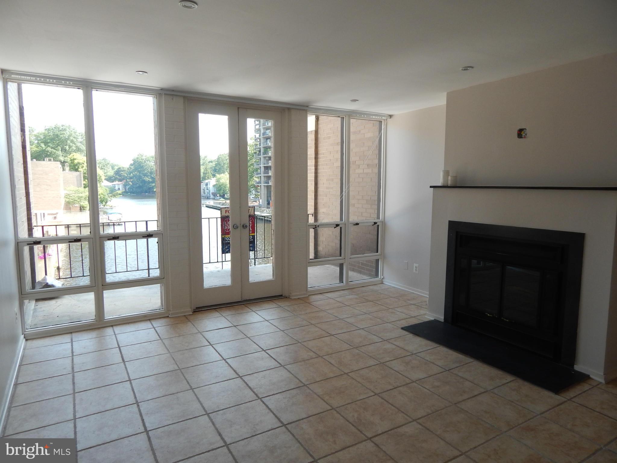 1620 Chimney House Road, Unit 1620 Reston, VA 20190 - Photo 2 of 16 a view of an empty room with a fireplace