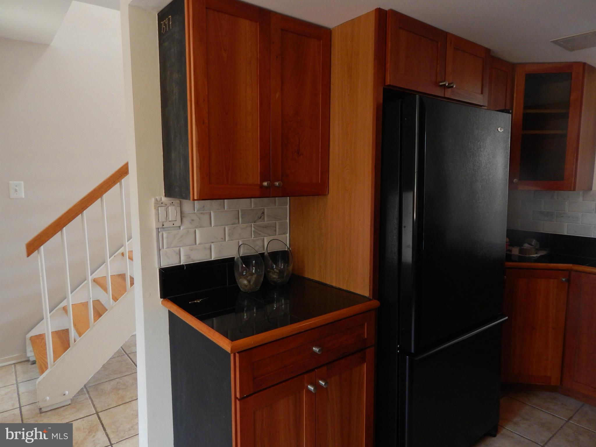 1620 Chimney House Road, Unit 1620 Reston, VA 20190 - Photo 14 of 16 a kitchen with a refrigerator and a stove