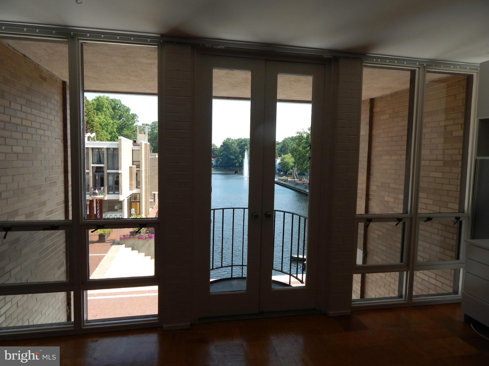 1620 Chimney House Road, Unit 1620 Reston, VA 20190 - Photo 5 of 16 a view of a large window with an outdoor space