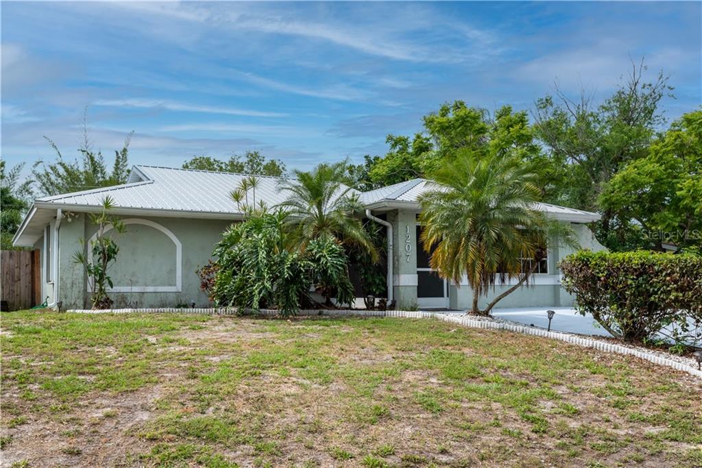 1207 Columbine Road Venice, FL 34293 - Photo 1 of 1 South Venice Tropical Retreat! 3 bedrooms + bonus room, 2 bath pool home on 5 lots covering approx. ½ acre with expansive tropical oasis