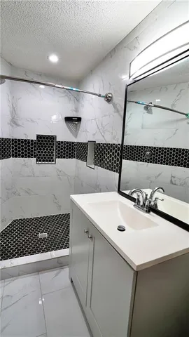 a view of a house with wooden deck and furniture