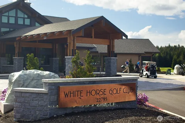 a front view of house with sign board