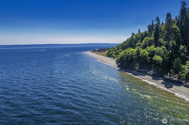 a view of an ocean beach and a yard