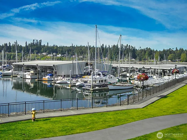 a view of a lake with couches and city view