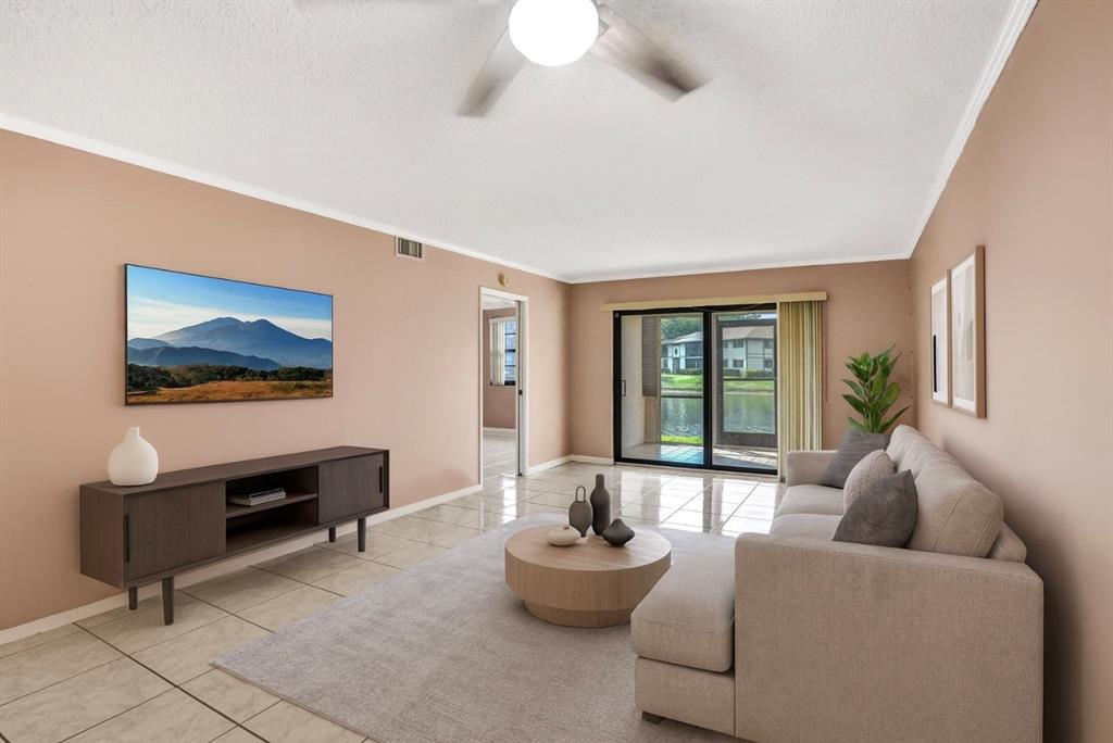 9573 West McNab Road, Unit 109 Tamarac, FL 33321 - Photo 13 of 29 a living room with furniture and a large window