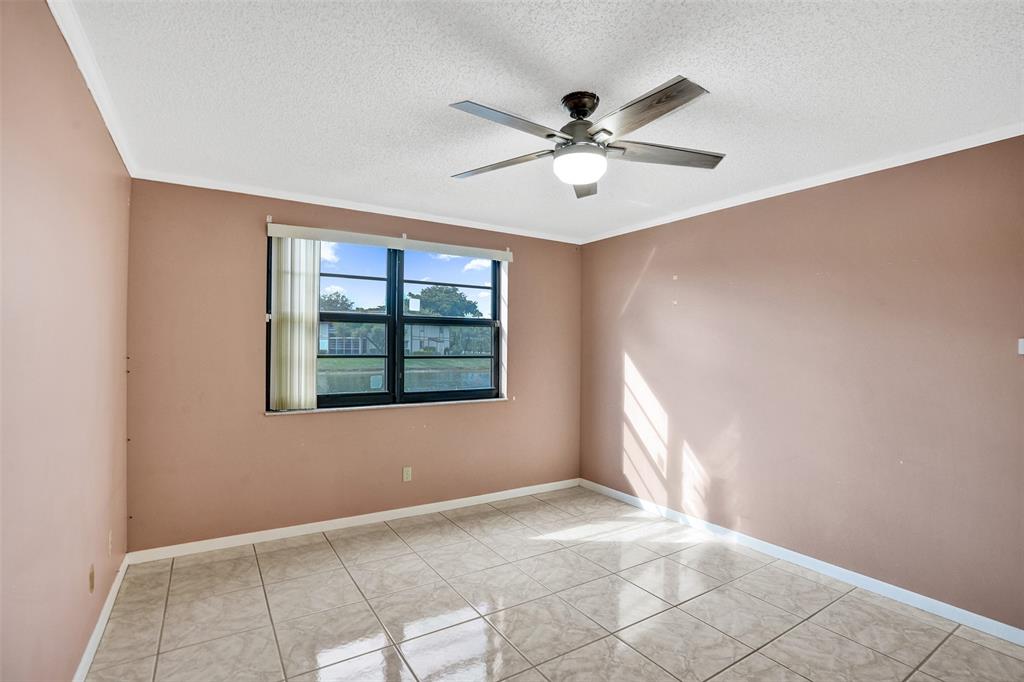 9573 West McNab Road, Unit 109 Tamarac, FL 33321 - Photo 15 of 29 a view of an empty room with a window