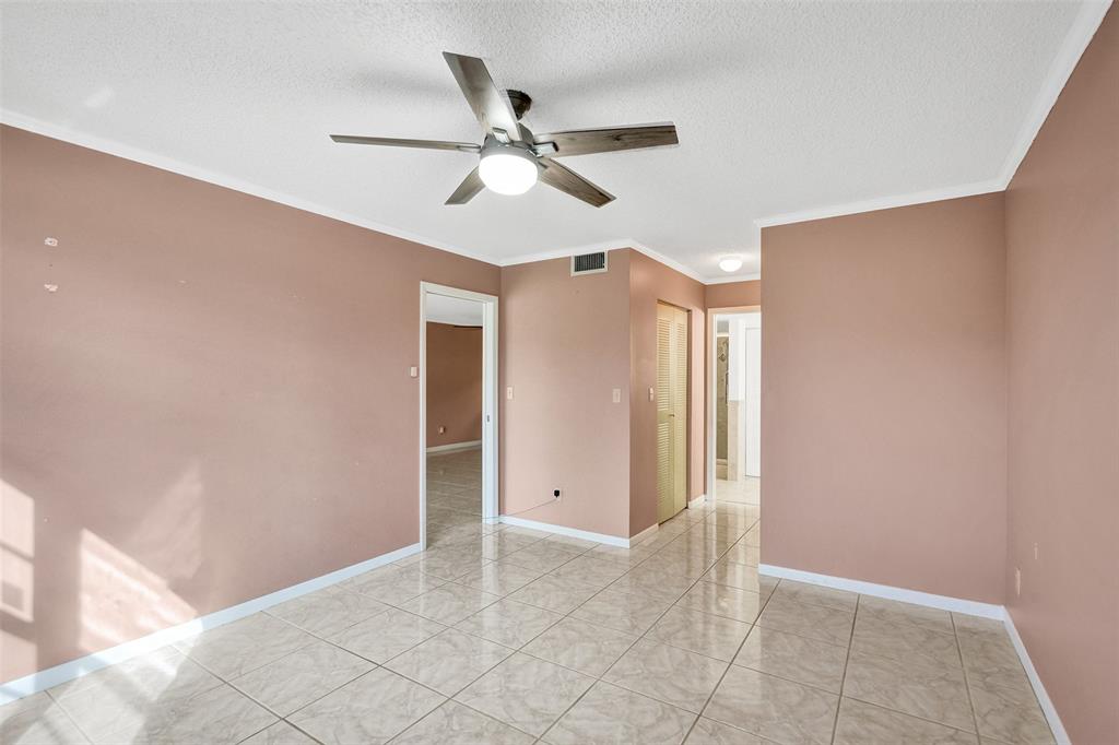 9573 West McNab Road, Unit 109 Tamarac, FL 33321 - Photo 16 of 29 a view of an empty room with a window