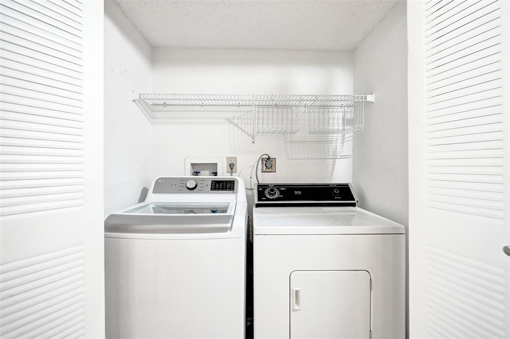 9573 West McNab Road, Unit 109 Tamarac, FL 33321 - Photo 23 of 29 a utility room with dryer and washer