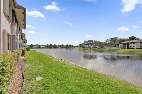 a view of a lake with houses in the background