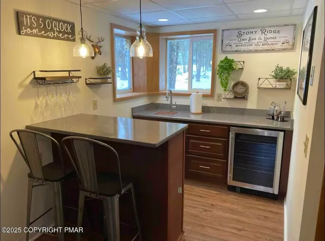 a kitchen with a table chairs and cabinets