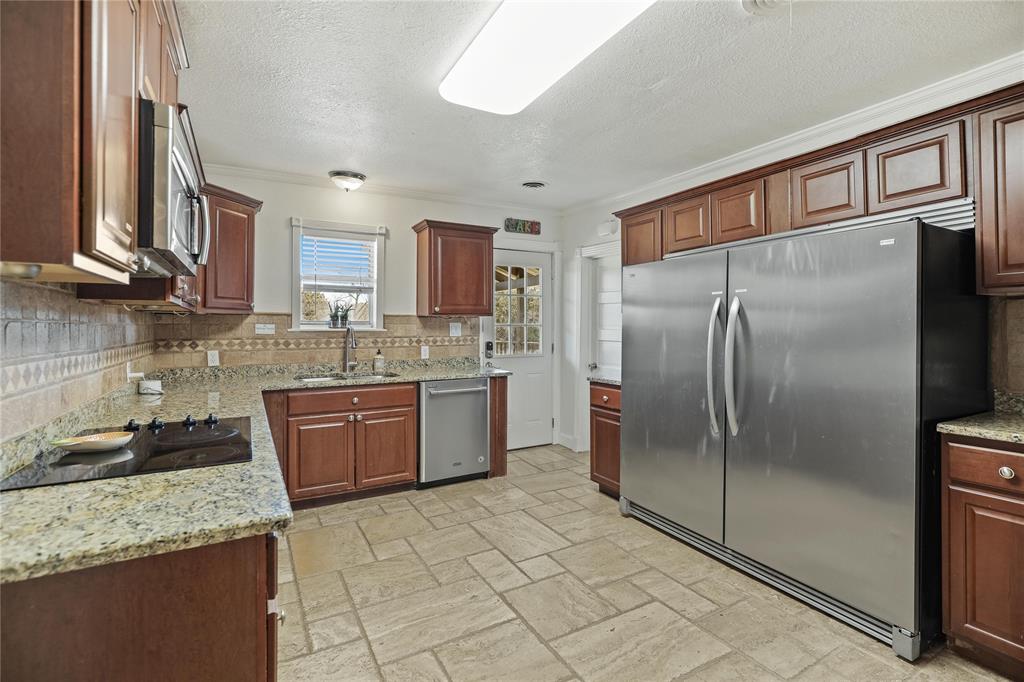 4843 Pike Road Graham, TX 76450 - Photo 14 of 37 All Stainless Appliances and Granite Counters in this Gourmet Kitchen with Commercial Frig and Double Ovens